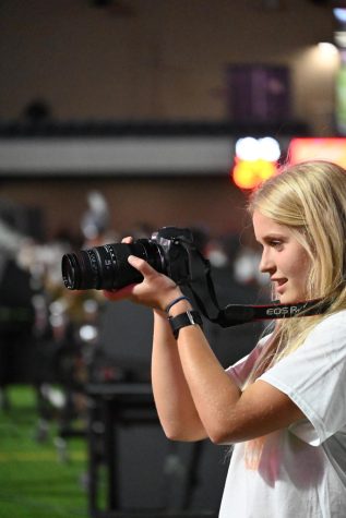 Jaime Rowe takes photos as she leads the Cougar yearbook staff as the editor in chief.